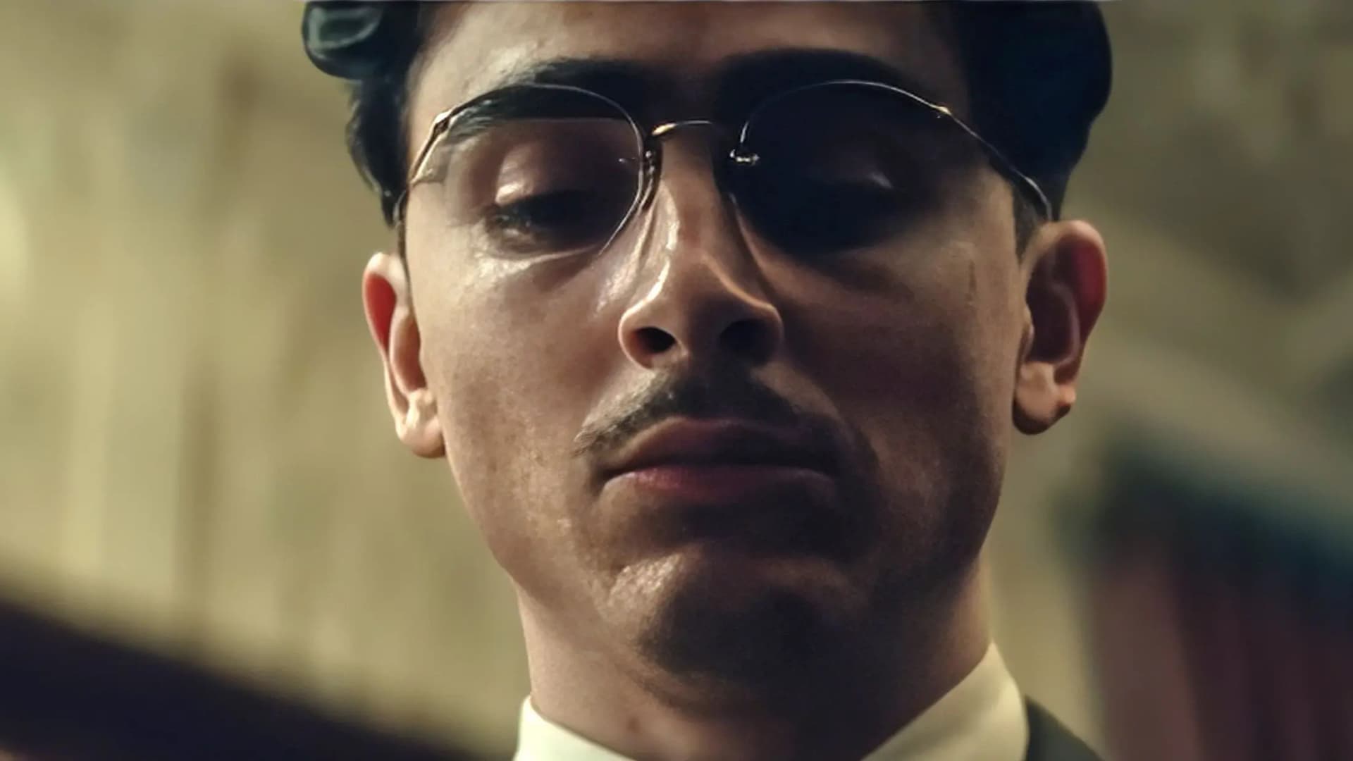 Timothée Chalamet intense close-up as Marty Mauser in Marty Supreme, highlighting his Oscar-contender performance