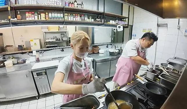 HyoYeon of Girls' Generation working in the kitchen with chef Lee Won-il in 'Chef's Emergency Landing: Hakka Kitchen 2'